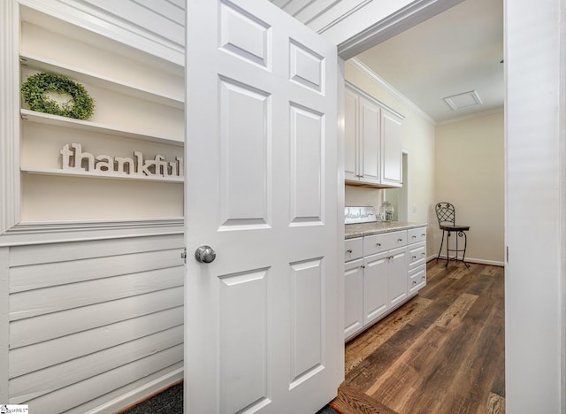 interior space with crown molding and dark hardwood / wood-style floors