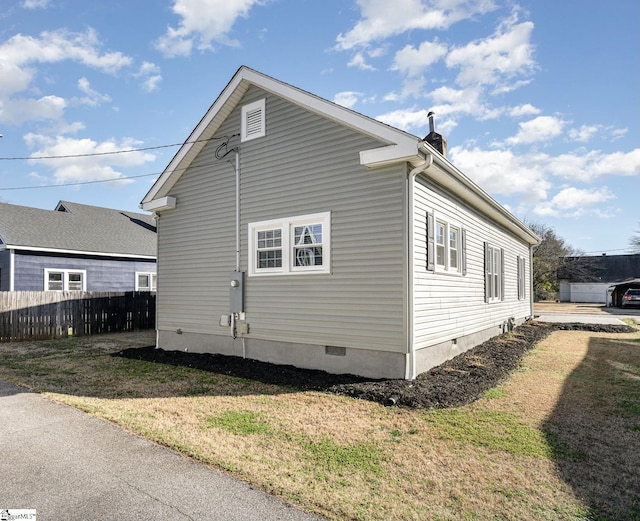 view of home's exterior featuring a yard