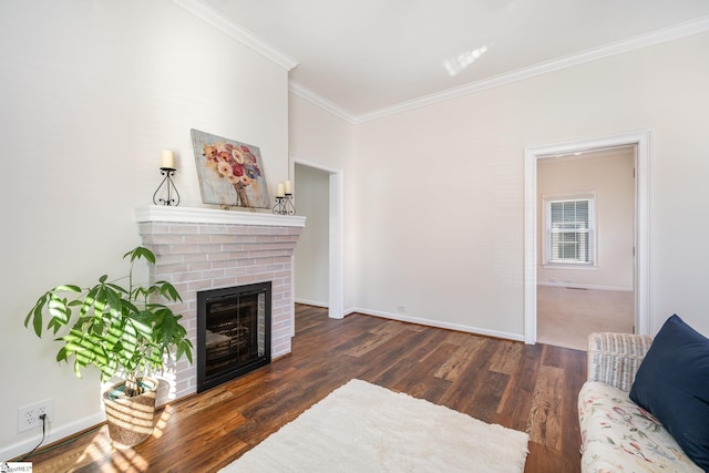 living room with dark wood-type flooring, a brick fireplace, and ornamental molding