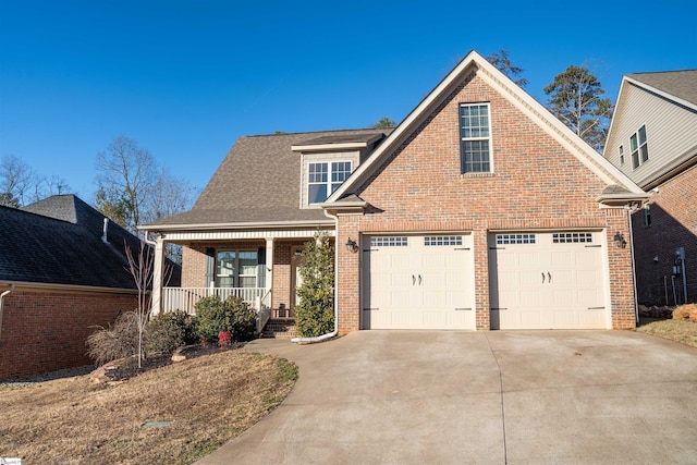 view of front of home with a porch and a garage