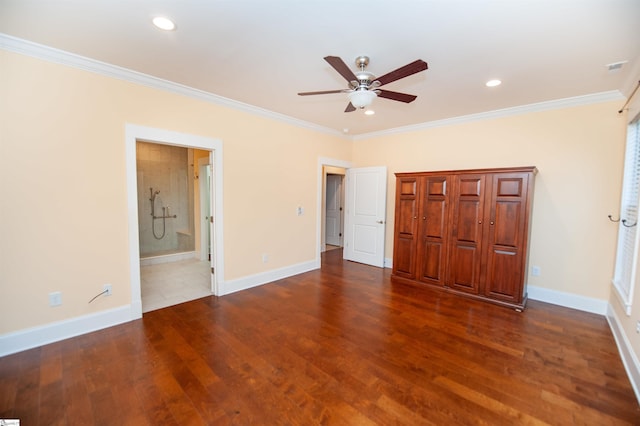 unfurnished bedroom with ensuite bath, ceiling fan, crown molding, and dark hardwood / wood-style floors