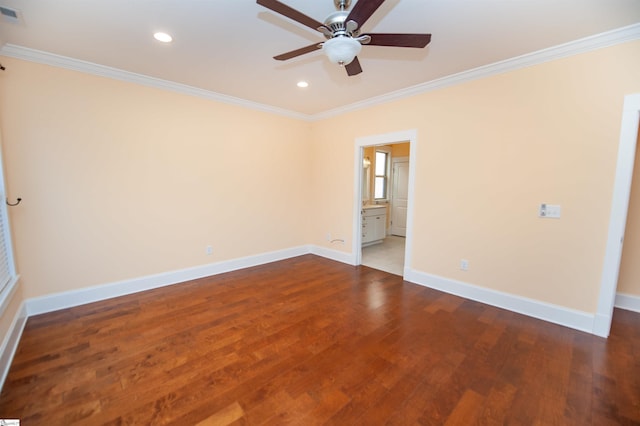 spare room featuring ceiling fan, ornamental molding, and wood-type flooring