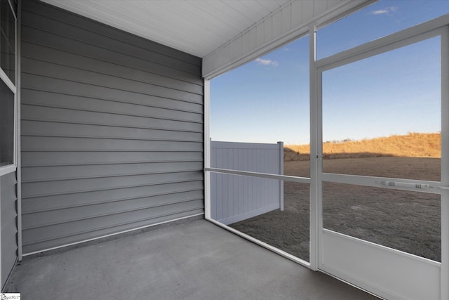 unfurnished sunroom with a wealth of natural light