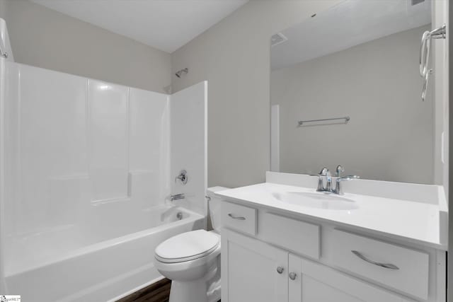 full bathroom with shower / tub combination, hardwood / wood-style floors, vanity, and toilet