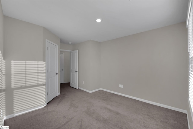 unfurnished bedroom with light carpet