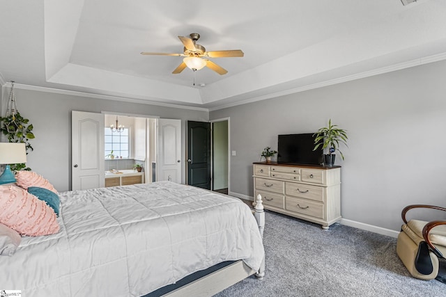 bedroom with carpet, ceiling fan with notable chandelier, and a tray ceiling