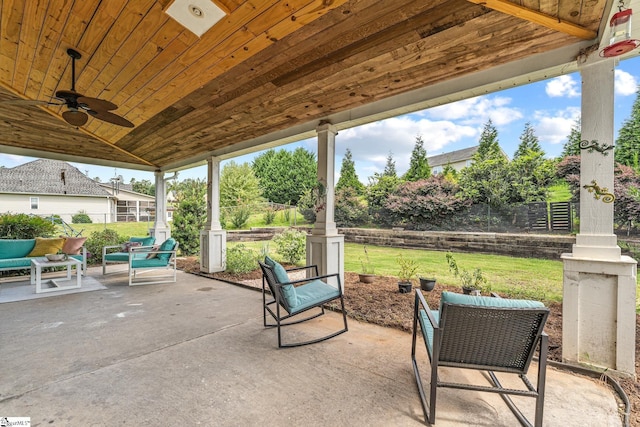 view of patio / terrace with ceiling fan and an outdoor living space