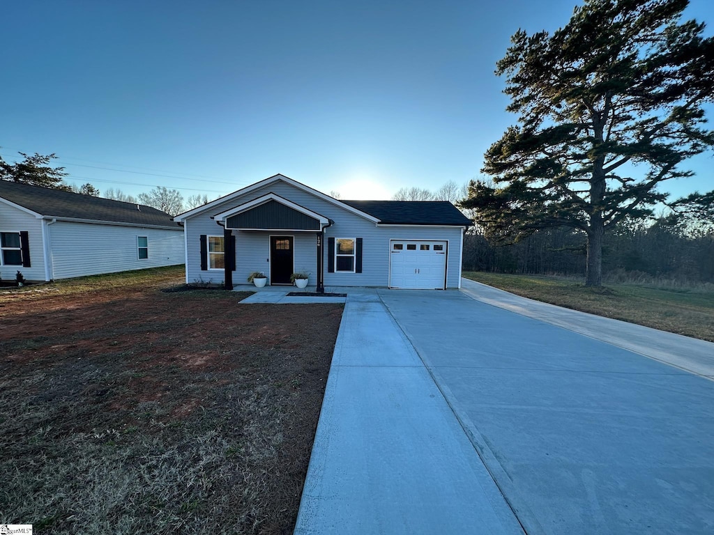 view of front of house with a porch and a garage