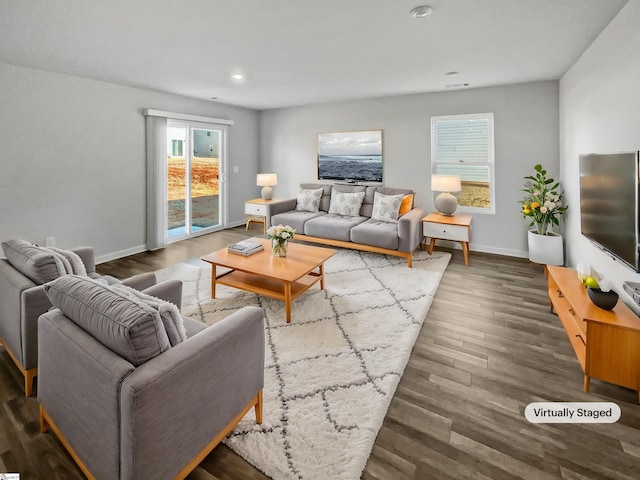 living room featuring dark wood-type flooring