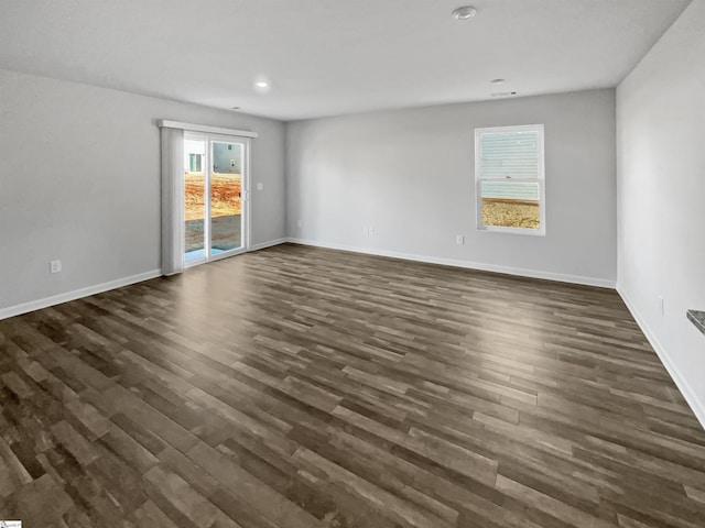 empty room featuring dark wood-type flooring