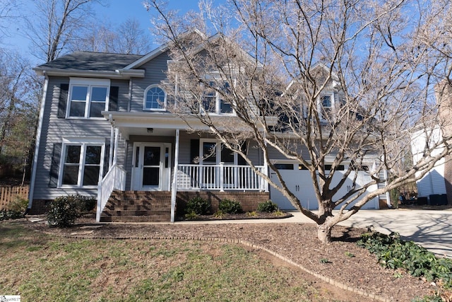 view of front of house featuring covered porch and a garage