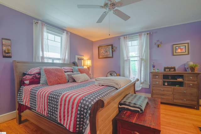 bedroom featuring light wood-type flooring and ceiling fan