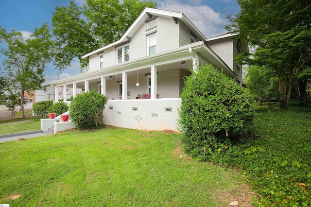 view of front of house featuring a front yard and covered porch