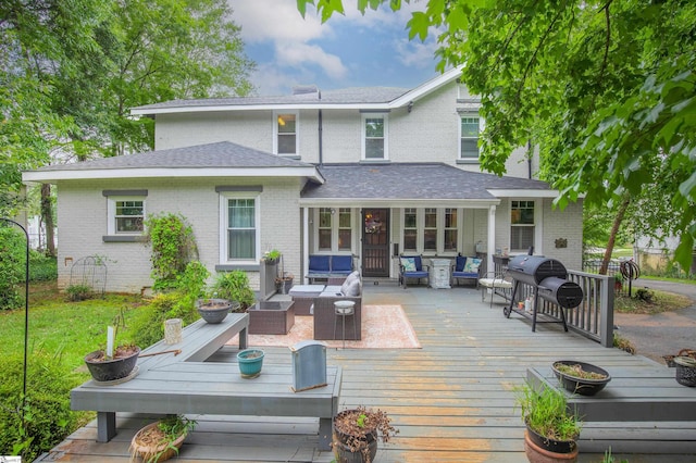 back of property featuring an outdoor living space and a wooden deck