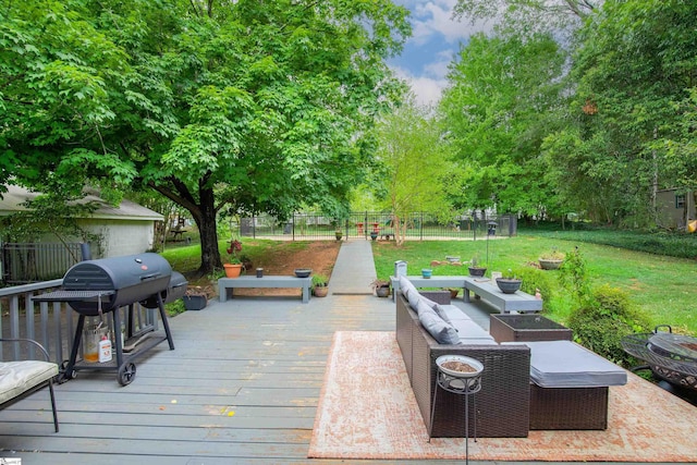 exterior space featuring a lawn, grilling area, a playground, and an outdoor living space