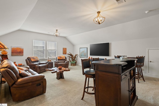 living room featuring light colored carpet, lofted ceiling, and a chandelier