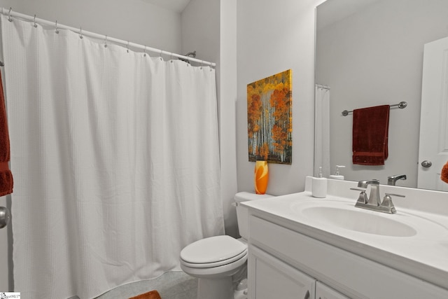 bathroom featuring toilet, vanity, and tile patterned floors