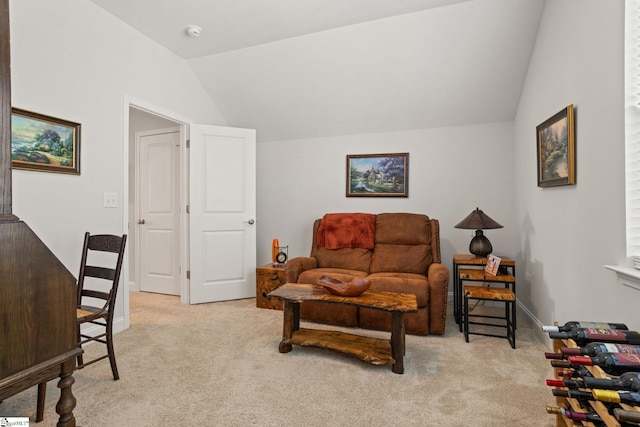 living area featuring light colored carpet and vaulted ceiling