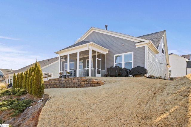 back of property featuring a sunroom