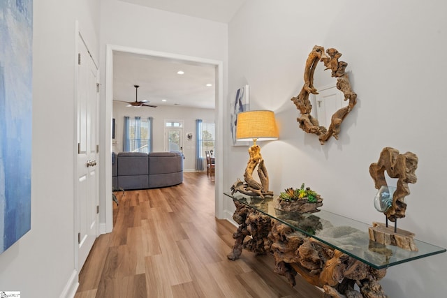 hall with light wood-type flooring