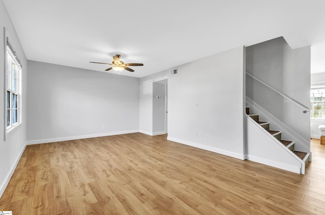 spare room with ceiling fan and light hardwood / wood-style flooring