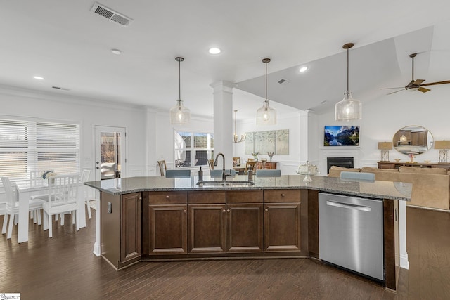 kitchen featuring hanging light fixtures, stone counters, ceiling fan, sink, and stainless steel dishwasher