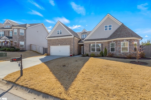 view of front of home with a front yard and a garage