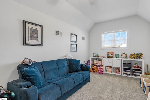 carpeted living room with vaulted ceiling