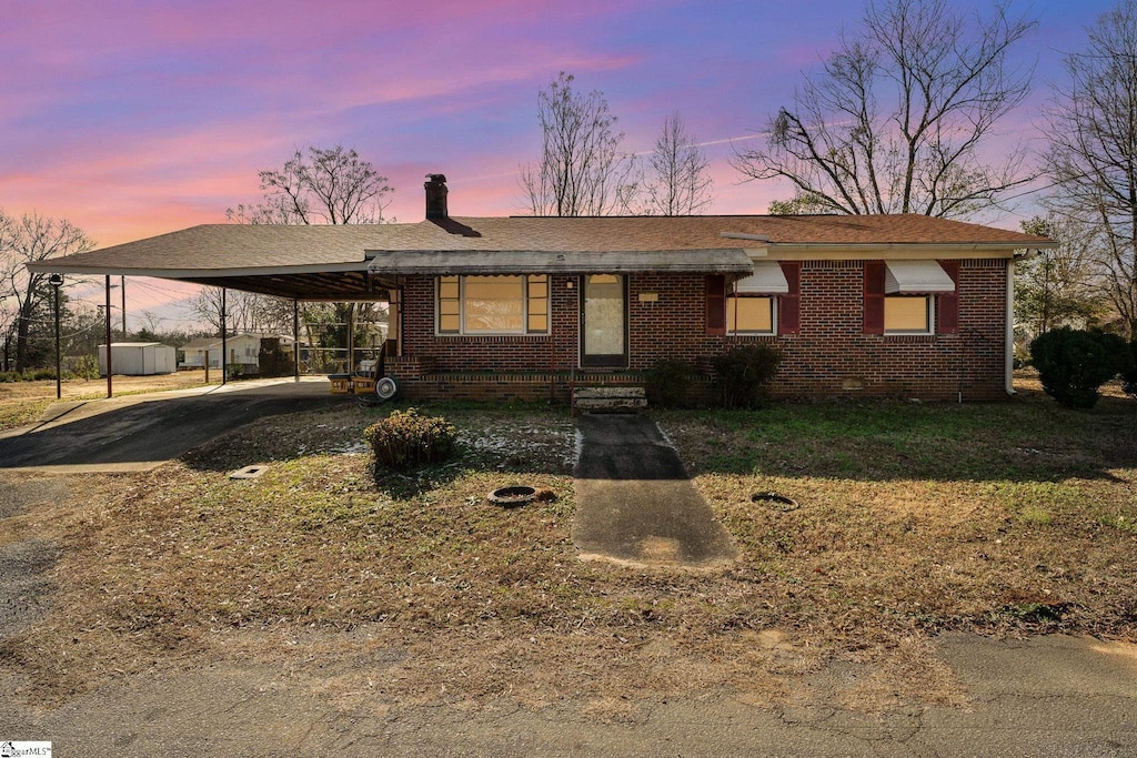 view of front of property with a carport