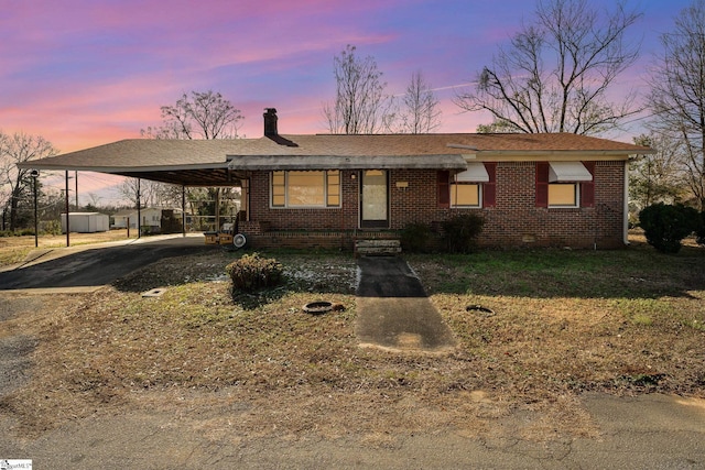 view of front of property with a carport