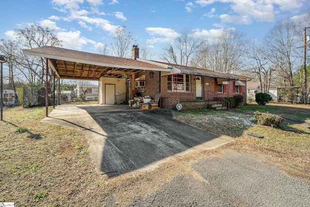 single story home with a carport