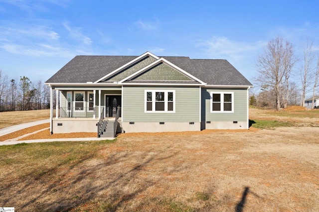 view of front of property with covered porch and a front lawn