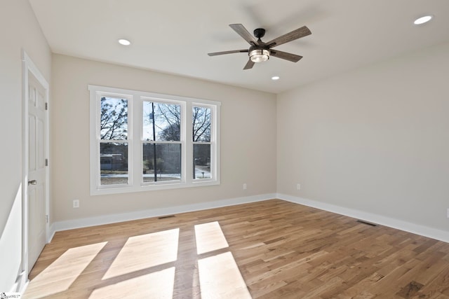 unfurnished room featuring ceiling fan and light hardwood / wood-style floors