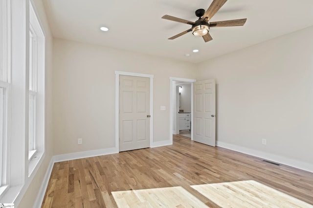 unfurnished bedroom featuring ceiling fan and light hardwood / wood-style floors