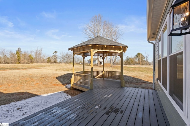 wooden terrace featuring a gazebo