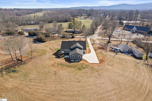 birds eye view of property with a mountain view