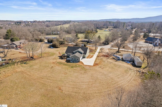 birds eye view of property with a rural view