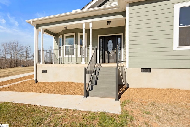 entrance to property featuring covered porch