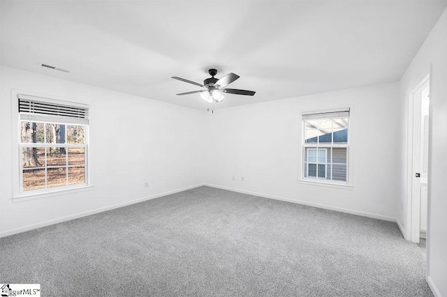 unfurnished room with carpet flooring and ceiling fan