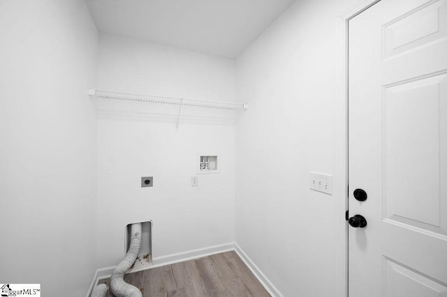 washroom featuring light hardwood / wood-style floors, electric dryer hookup, and hookup for a washing machine