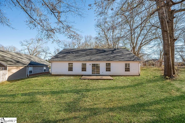 back of property featuring a yard and a patio