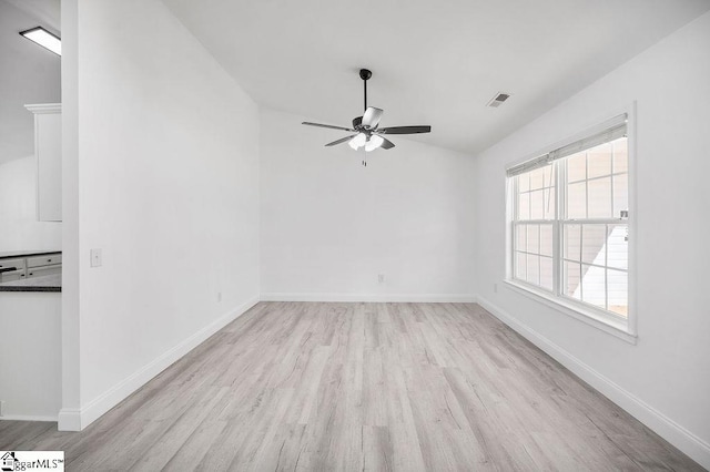 spare room with ceiling fan and light hardwood / wood-style floors