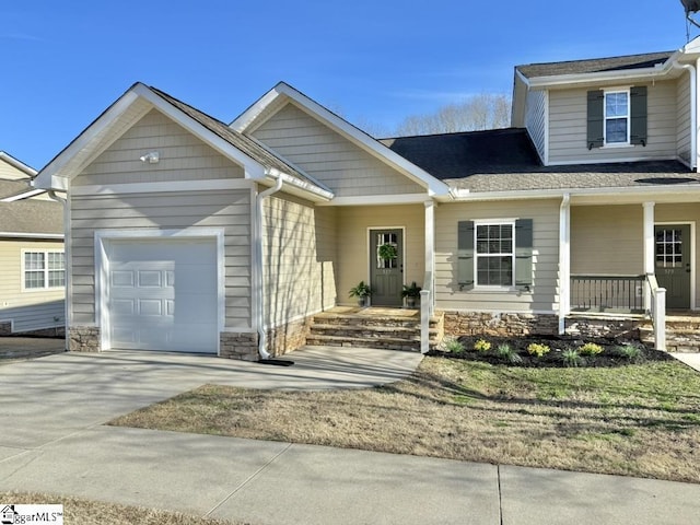 view of front of property with a garage and covered porch