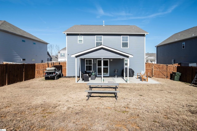 rear view of house with a patio