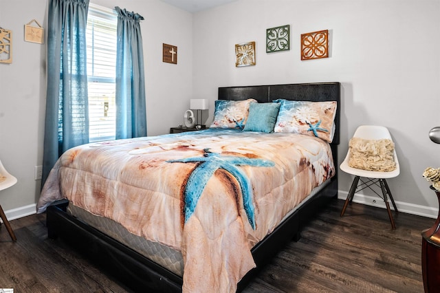 bedroom featuring dark hardwood / wood-style flooring