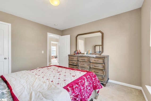 bedroom featuring light colored carpet