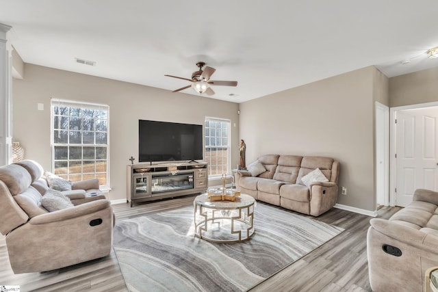 living room with ceiling fan and hardwood / wood-style floors