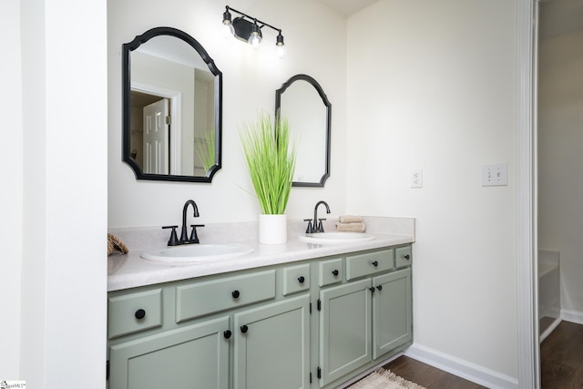 bathroom with vanity and hardwood / wood-style floors