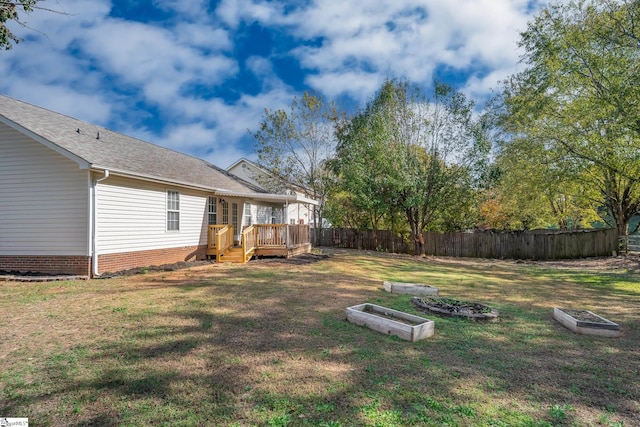 view of yard featuring a deck