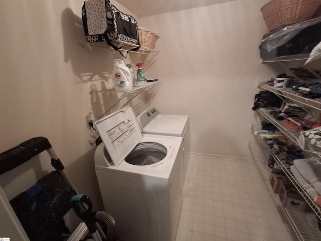 laundry room with separate washer and dryer